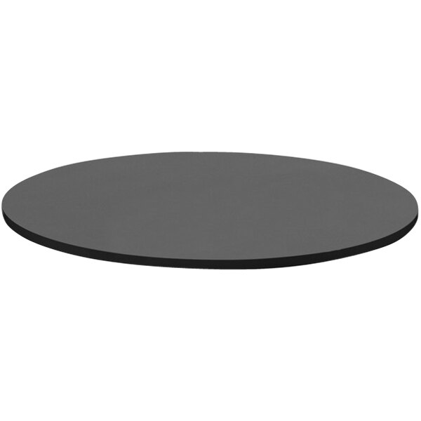A close-up of a Correll black granite round table top.