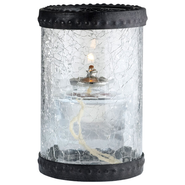 A Sterno clear crackle glass candle holder with a candle inside and bronze rings.