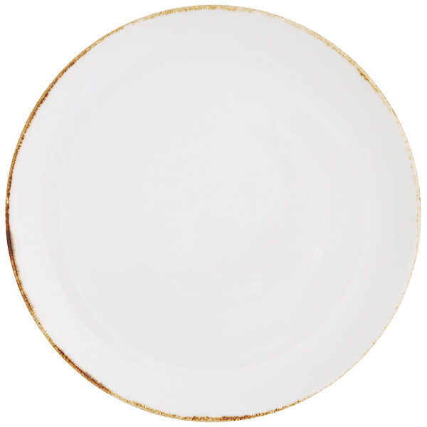 A white Fortessa coupe plate with a gold rim.