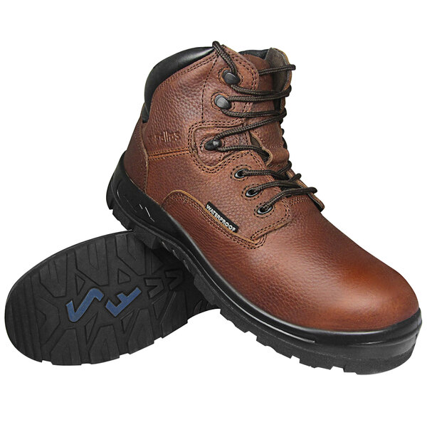A brown Genuine Grip Poseidon soft toe boot with black soles.