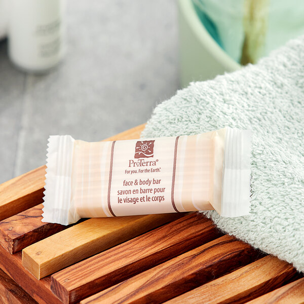 A ProTerra Honey and Vanilla soap bar on a white towel.