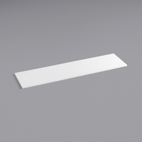 A white rectangular Avantco extra deep cutting board on a gray surface.