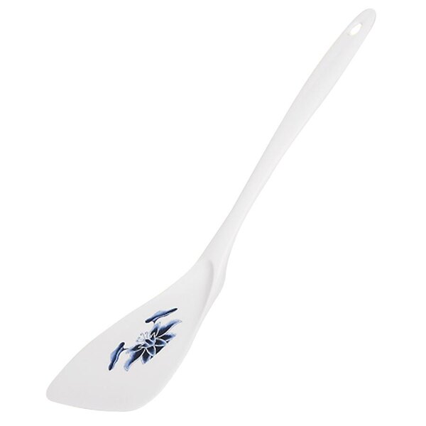 A white spatula with a blue water lily design on the turning end.