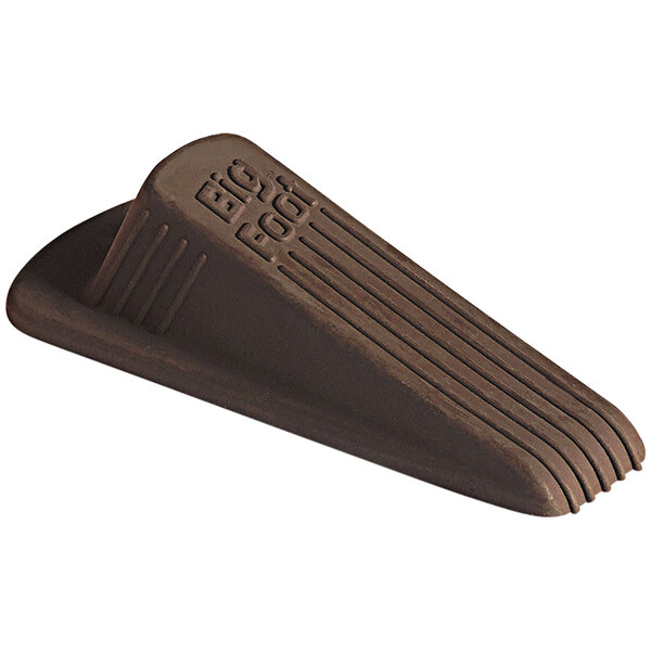 A brown rubber Master Caster door stop with text on it.