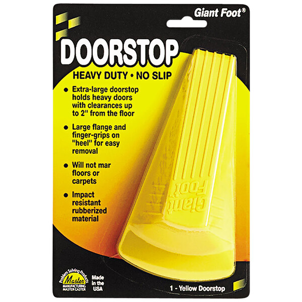 A yellow Master Caster door stopper in a yellow package.