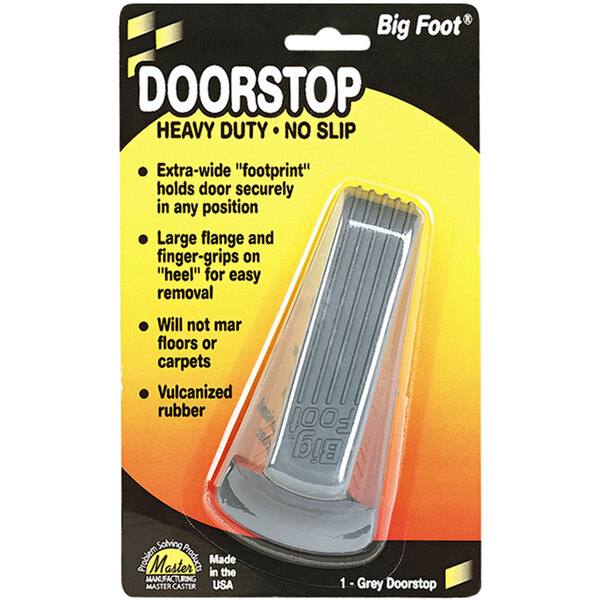 A package of Master Caster Big Foot gray rubber door stoppers with a no-slip pad.