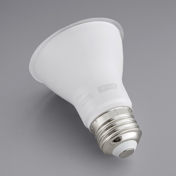 A white Eiko PAR20 LED light bulb with a silver base on a gray surface.