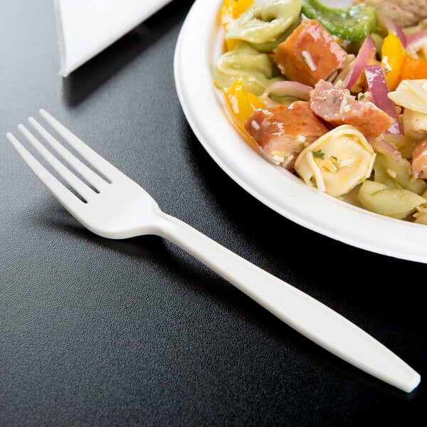 A white plate of pasta with a 7 1/8" heavy weight cornstarch fork.
