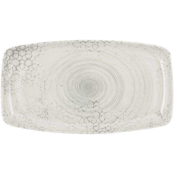 A white rectangular plate with a swirl pattern.