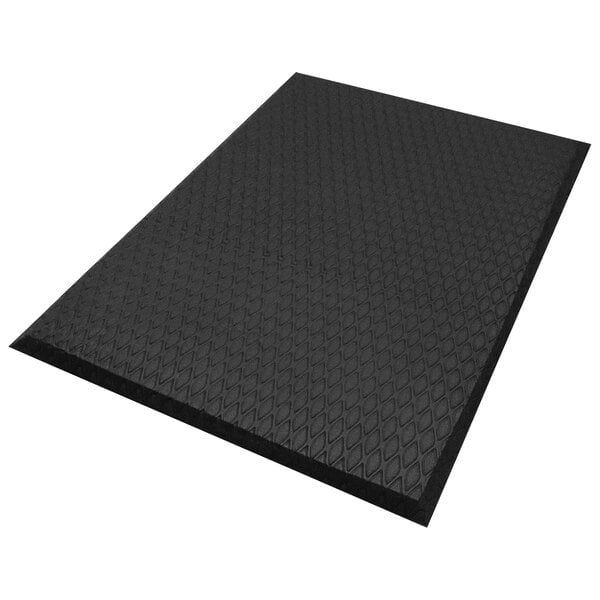 A black rectangular M+A Matting Cushion Max mat with a diamond pattern.