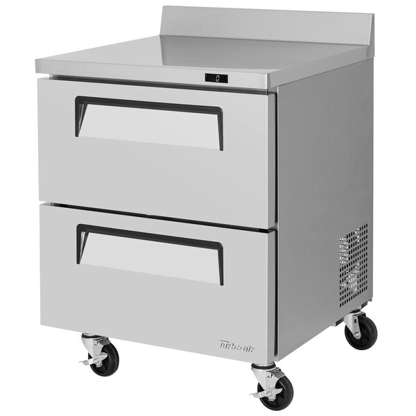 A stainless steel Turbo Air worktop freezer with two drawers on wheels.