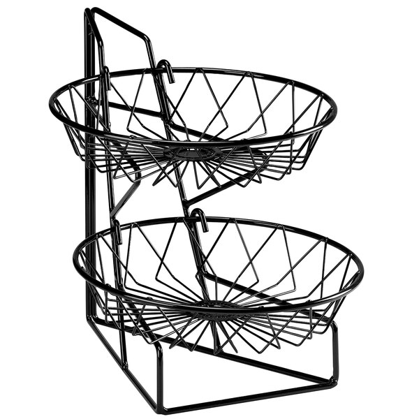 A Cal-Mil two tier wire merchandiser stand with black baskets on a counter.