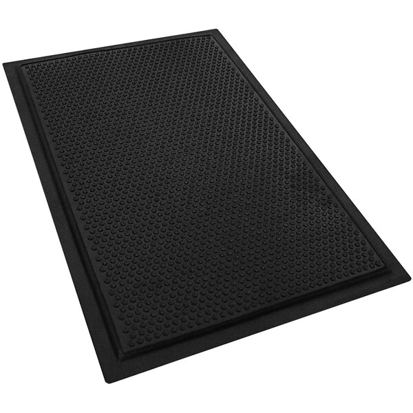 A black rubber M+A Matting anti-fatigue mat with dots on the bottom.