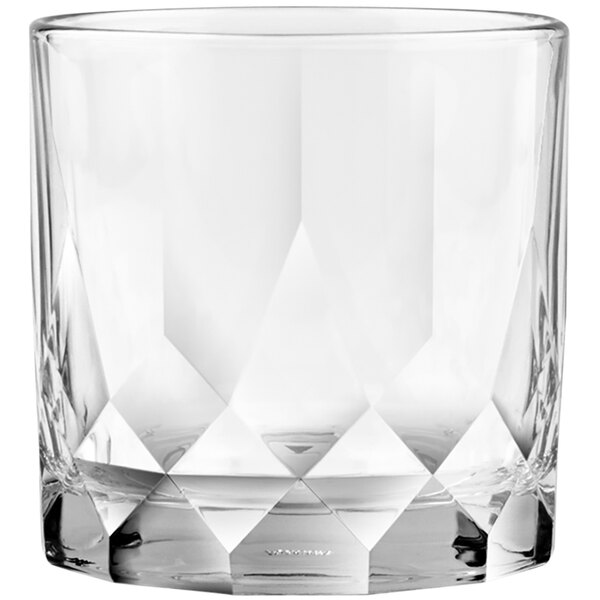 A close up of a Connexion double old fashioned glass with diamond cut design.