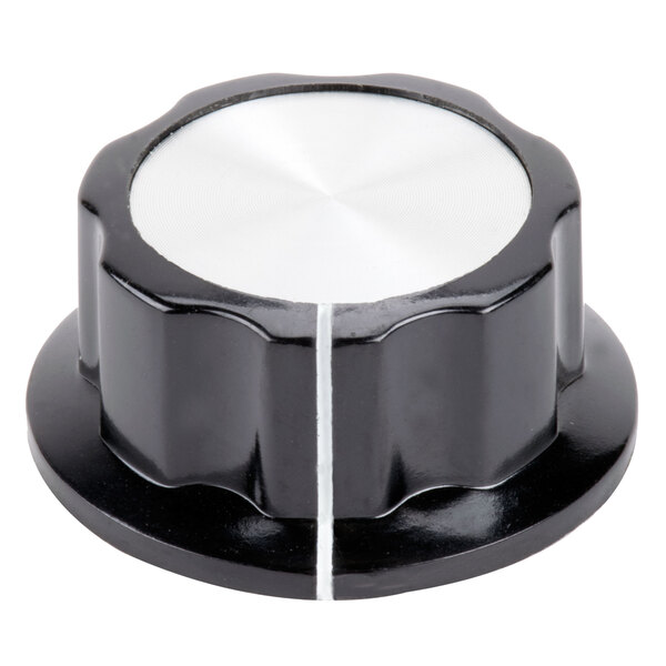 A black knob with white trim.
