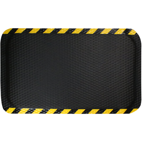 A black rectangular anti-fatigue mat with a yellow striped border.