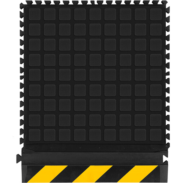 A black square industrial mat with a yellow striped border.