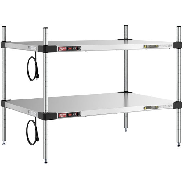 A Metro stainless steel heated countertop takeout station with two shelves on each side.