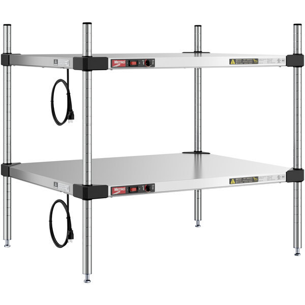 A Metro stainless steel countertop heated takeout station with two shelves.