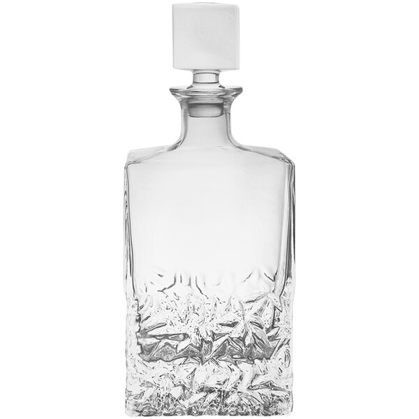 A clear glass rectangular decanter with a crystal stopper.