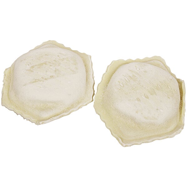 Two Bernardi Jumbo cheese ravioli on a white background.