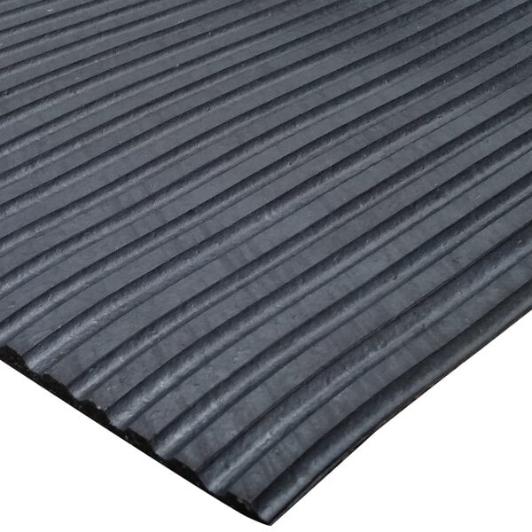 A black rubber Duratred mat with large ridges.