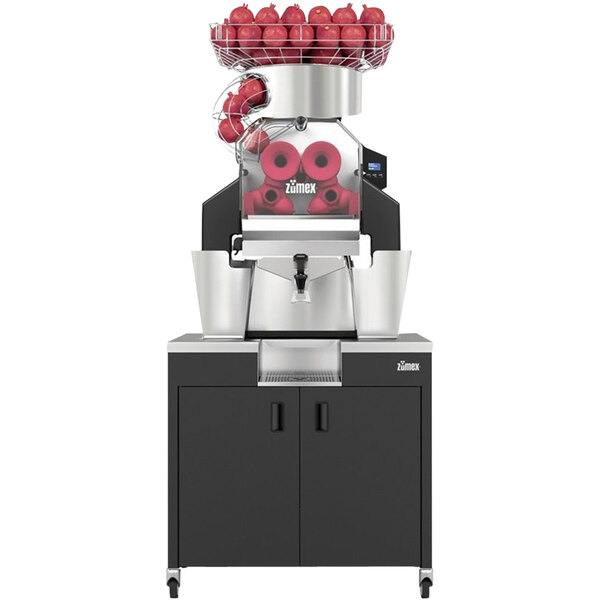 A Zumex Speed Up pomegranate juicer with a white podium and black accents.