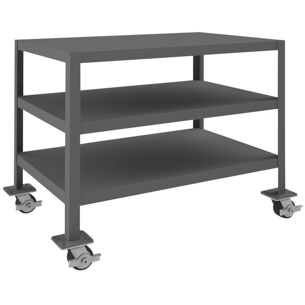 A grey metal Durham machine table shelf with wheels.