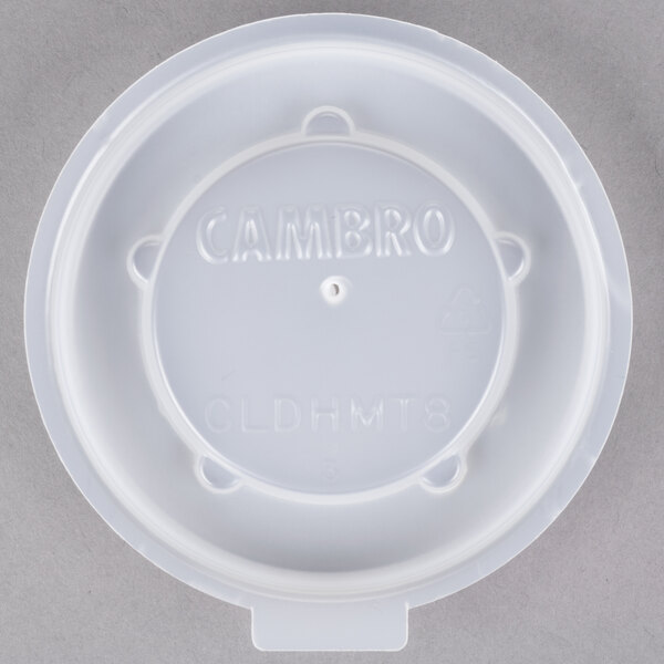A translucent plastic lid with embossed text for a Cambro insulated mug.