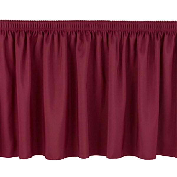 A burgundy shirred stage skirt with pleated bottom.