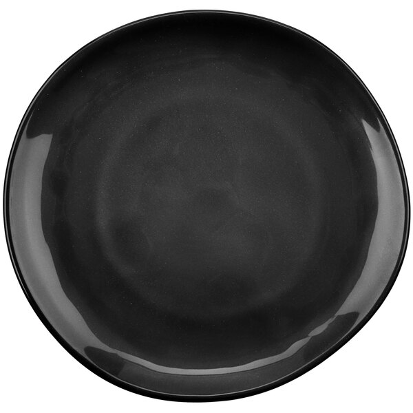 A black GET Cosmo melamine coupe plate with an irregular rim.