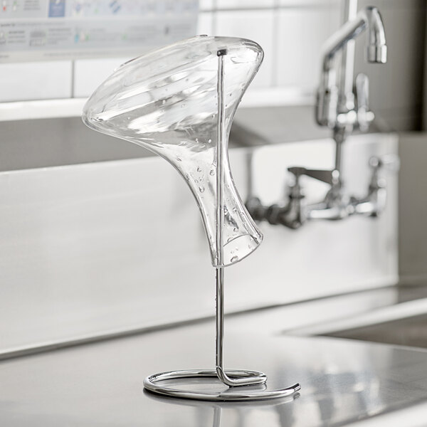 An Acopa wine decanter drying stem holding a clear glass wine decanter.