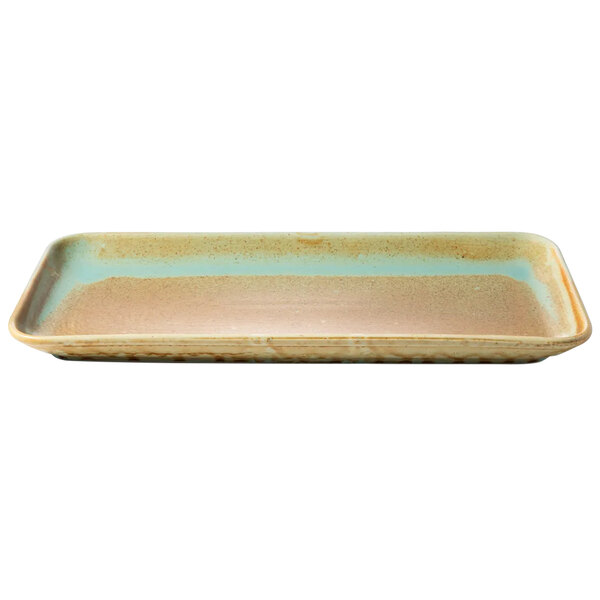 A teal rectangular porcelain platter with a pattern on the surface.