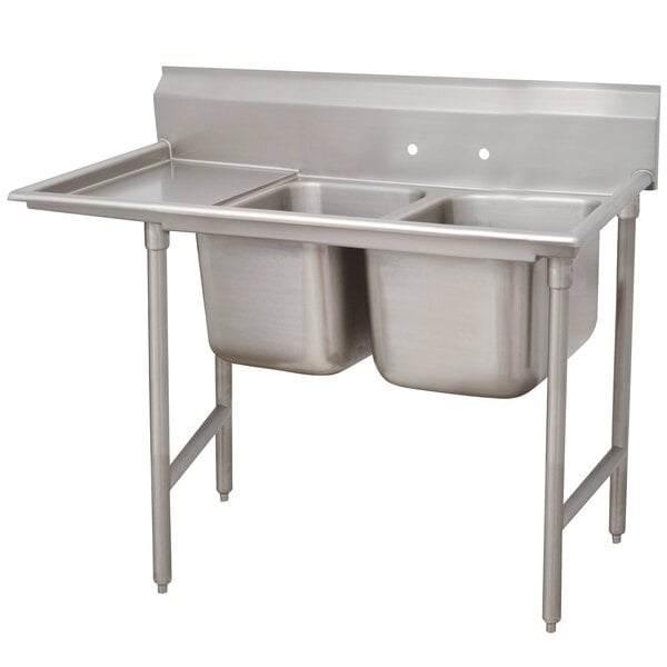 An Advance Tabco stainless steel two-compartment sink with left drainboard.