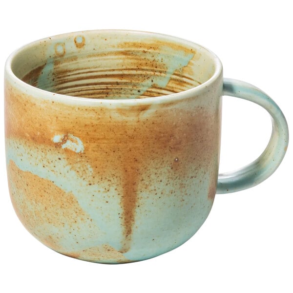 A close up of a teal Bon Chef porcelain mug with a handle.