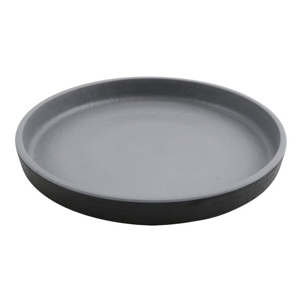 A round black GET Roca melamine plate.