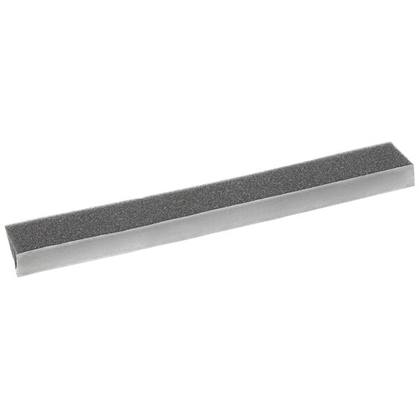 A grey rectangular gasket with a silver edge.