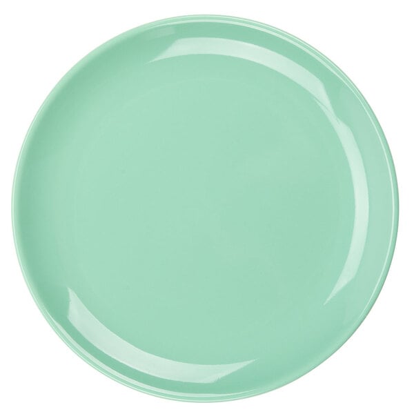 A close-up of a light green Tuxton Healthcare China plate.