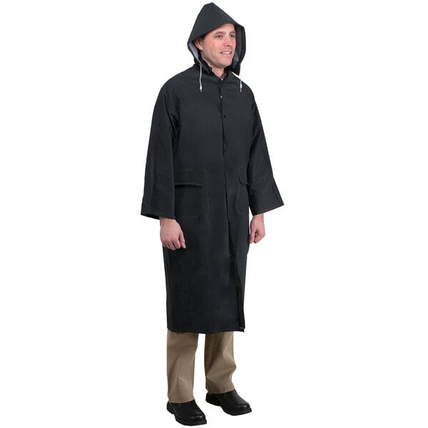 A man wearing a black Cordova rain coat.