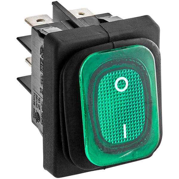 A green rocker switch with white text.