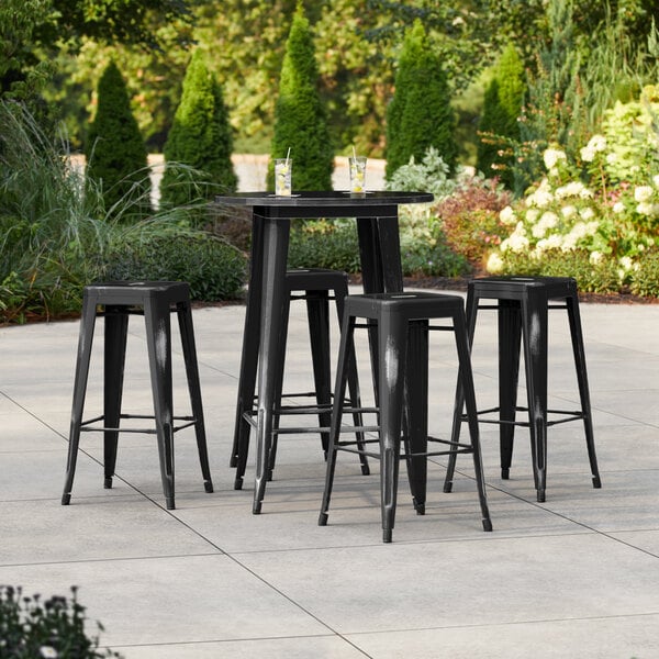 Lancaster Table & Seating Alloy Series 30" Round Distressed Black Bar Height Outdoor Table with 4 Backless Barstools