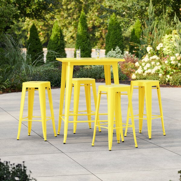 Lancaster Table & Seating Alloy Series 31 1/2" x 31 1/2" Citrine Yellow Bar Height Outdoor Table with 4 Backless Barstools