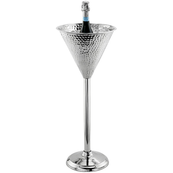 A champagne bottle in a stainless steel Franmara wine chiller on a stand.