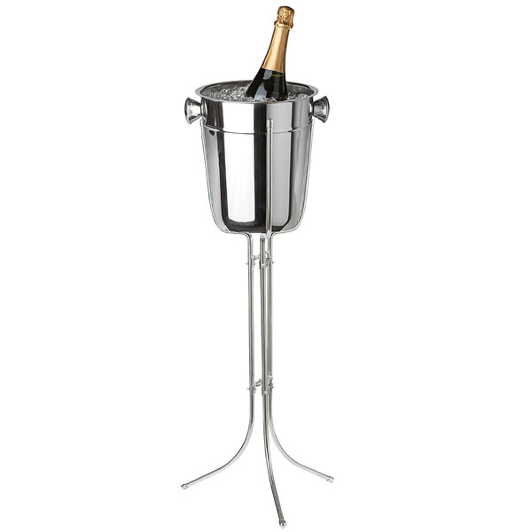 A champagne bottle in a Franmara stainless steel wine cooler on a stand.