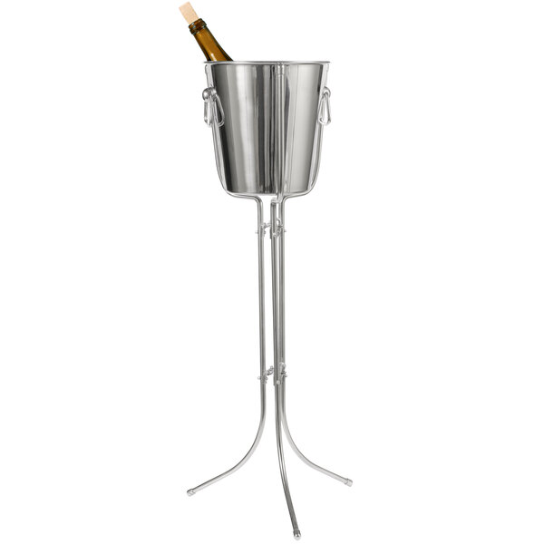 A Franmara stainless steel wine bucket on a metal stand holding a wine bottle.