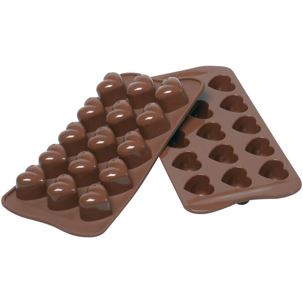 A Silikomart brown silicone chocolate mold with heart shaped compartments.