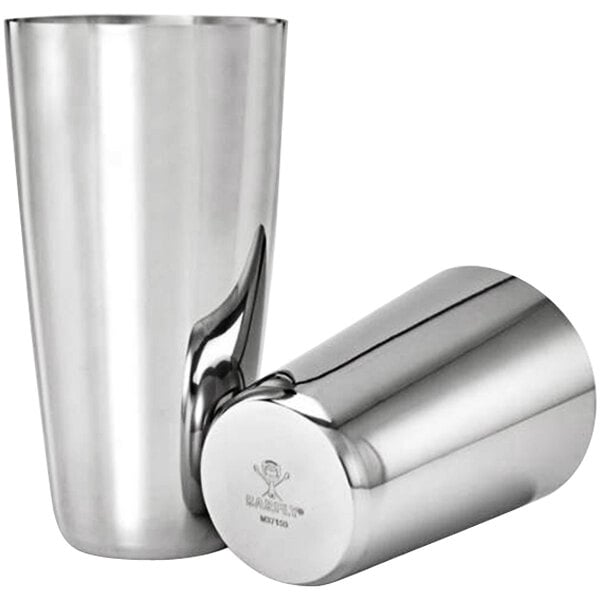 A close-up of a silver Barfly cocktail shaker with two stainless steel tumblers with lids.