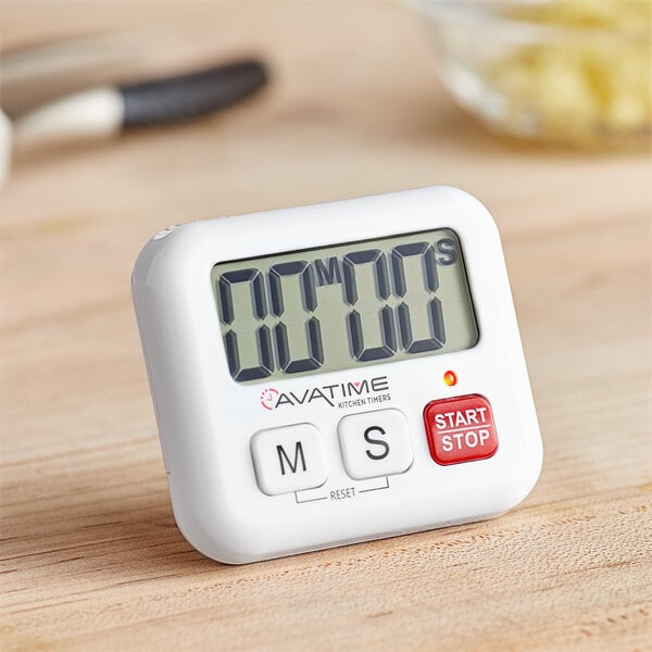 A white AvaTime digital kitchen timer on a wooden table.