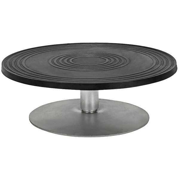 A round black table with a metal base.