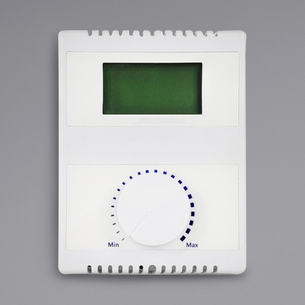 A white rectangular thermostat with a green screen.
